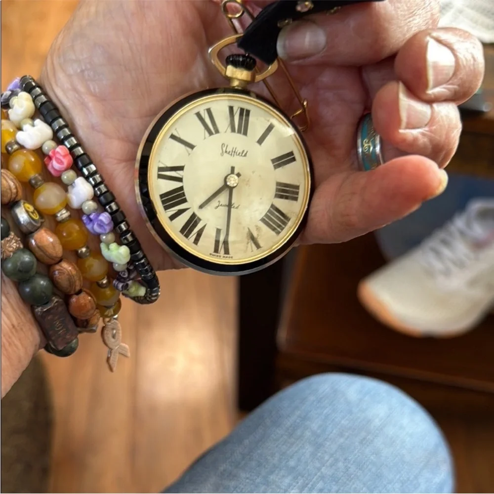vintage Sheffield‎ Home black and gold pocket watch.